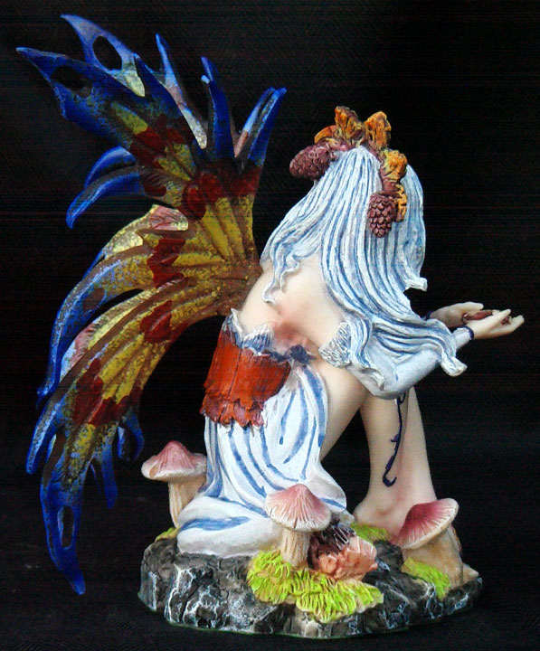 fairy on mushroom statue